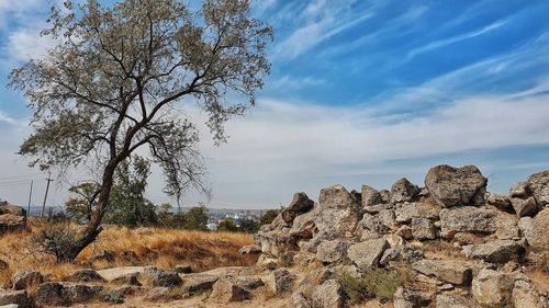 View of rock formation on landscape against sky