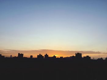 Silhouette of building at sunset