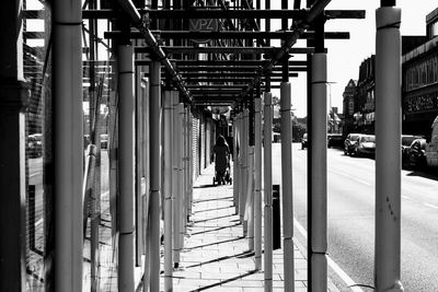 Rear view of people walking on footpath
