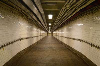 Interior of empty illuminated tunnel