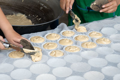 Midsection of man preparing food