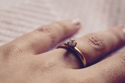 Cropped hand of woman wearing ring