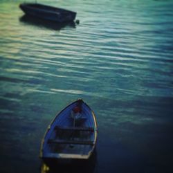 Close-up of boat sailing on lake