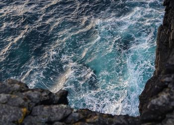 Sea waves splashing on rocks