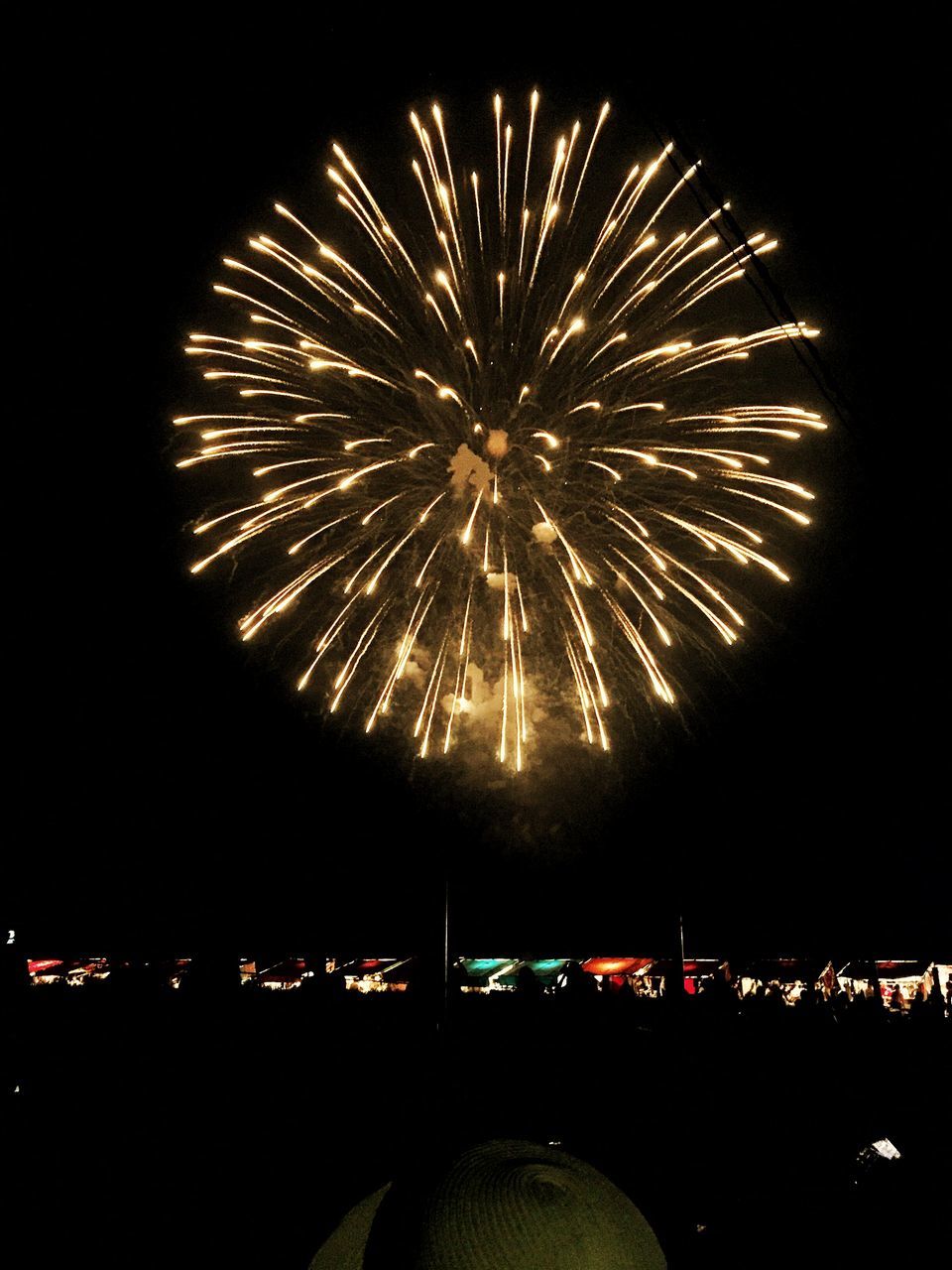 night, illuminated, firework display, exploding, arts culture and entertainment, long exposure, celebration, glowing, firework - man made object, motion, event, sparks, low angle view, blurred motion, sky, firework, entertainment, dark, multi colored, celebration event