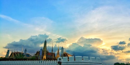 Low angle view of buildings against sky during sunset