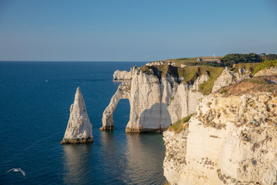 Scenic view of sea against evening sky to alabaster coast, Étretat, normandie, france.