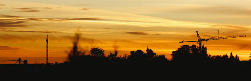 Silhouette of trees against sky during sunset