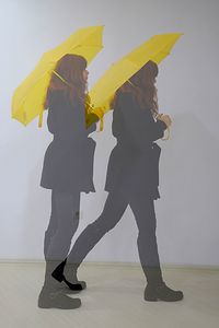 Low section of woman with umbrella