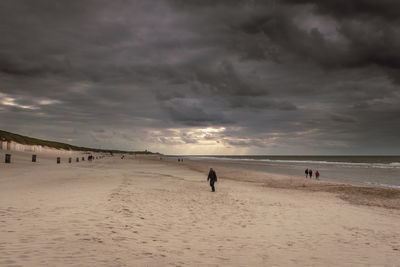 Scenic view of beach against sky during sunset