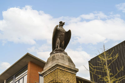 Low angle view of statue against sky