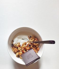 High angle view of food in bowl against white background