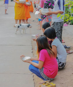 Rear view of girl with umbrella