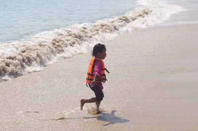 Full length of boy on beach