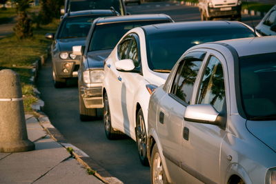 Cars in row on road