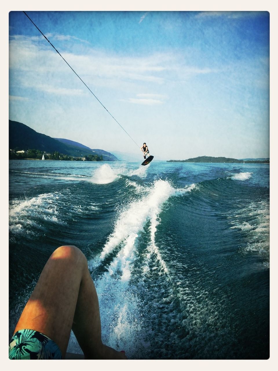 water, sea, transfer print, lifestyles, leisure activity, horizon over water, auto post production filter, person, sky, men, part of, unrecognizable person, holding, one man only, personal perspective, nature, cropped