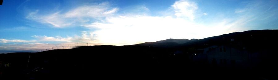 Silhouette mountains against sky