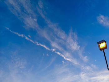 Low angle view of illuminated light against sky