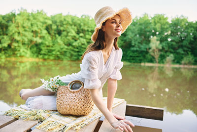 Young woman sitting on bench