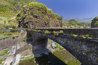 View of bridge over mountain against sky