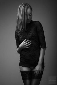 Woman standing against wall