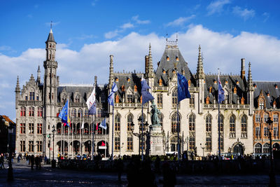 Panoramic view of buildings in city against sky