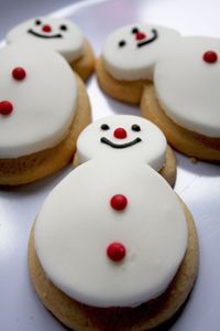 Close-up of snowman shaped gingerbread cookies in plate