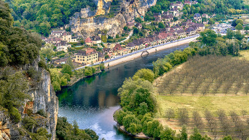 High angle view of river by buildings in city