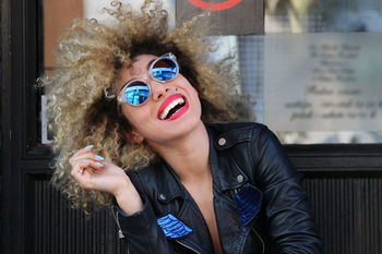 Portrait of happy woman in sunglasses