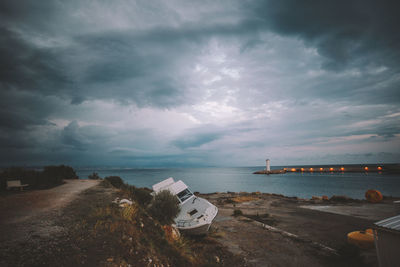 Scenic view of sea against storm clouds