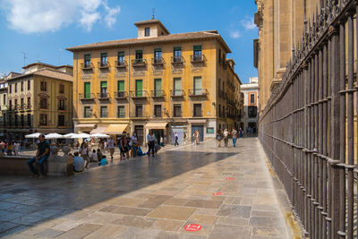 People walking on street in city