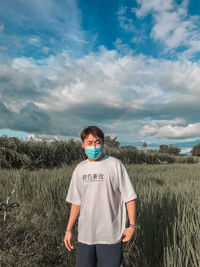 Full length of man standing on land against sky