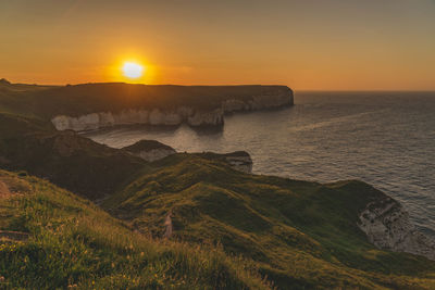 Scenic view of sea against sky during sunset