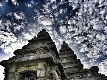 Low angle view of church against cloudy sky