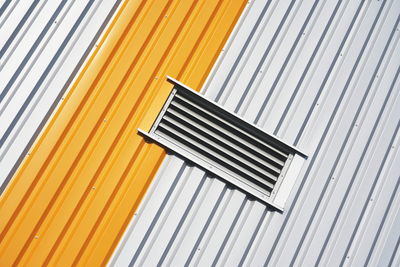 Directly above shot of metal grate against white background