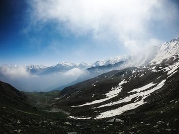 Scenic view of snowcapped mountains against sky