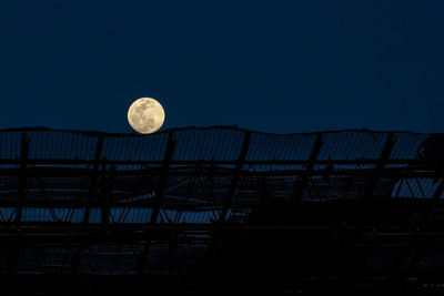 Low angle view of moon against sky at night