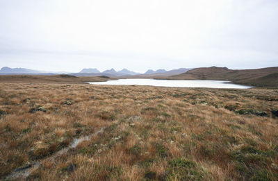 Scenic view of landscape and mountains against sky