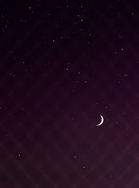 Low angle view of moon against sky at night