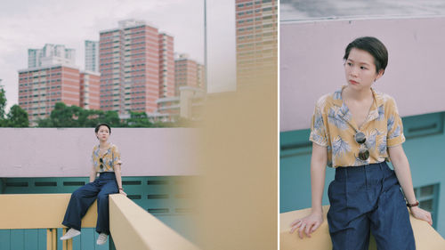 Young woman standing against building in city