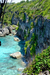 Scenic view of rocks by sea