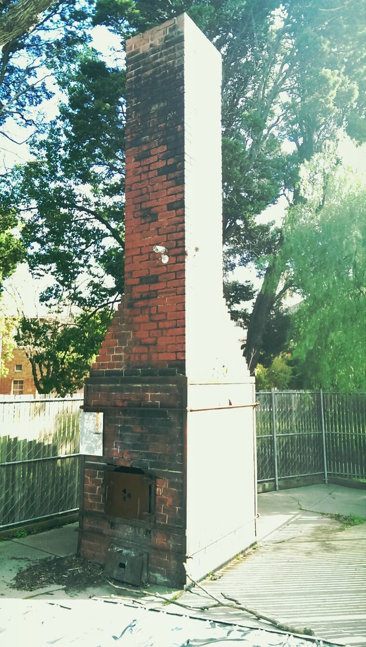 architecture, built structure, building exterior, entrance, door, sunlight, tree, day, shadow, outdoors, house, gate, building, no people, closed, protection, safety, wall - building feature, security, window