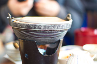 Cropped image of bowl on table