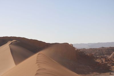 View of desert against clear sky