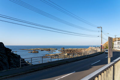 Scenic view of sea against clear blue sky