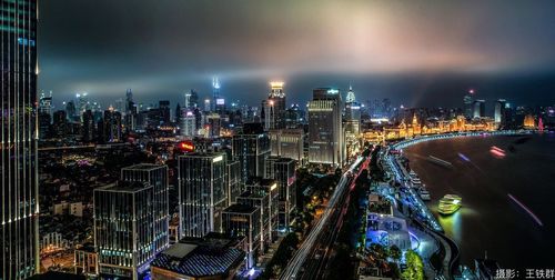 High angle view of illuminated city buildings at night