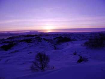 Scenic view of landscape against sky during winter