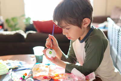 Boy eating food at home