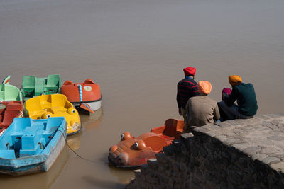 High angle view of people floating on lake