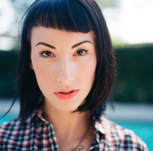 Extreme close up portrait of a serious young woman